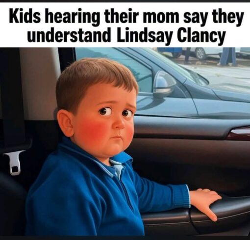 Anxiety Memes, Child Abuse Memes, Current Event Memes, Dark Humor, Family Memes, Funniest Memes, Homicide Memes, Kid Memes, Kids vs Parents Memes, Lindsay Clancy, Mom Memes, News Memes, Parent Memes, Tragedy Memes, A young boy sits in the back seat of a car, turned slightly toward the camera with a tense, uneasy side-eye expression. His cheeks are flushed, his hand rests on the door, and the whole pose makes him look like he has just heard something deeply alarming from the front seat. Across the top, large bold text reads: “Kids hearing their mom say they understand Lindsay Clancy.” The innocent child’s worried face becomes the punchline, turning an ordinary car-seat moment into a darkly comic reaction image.