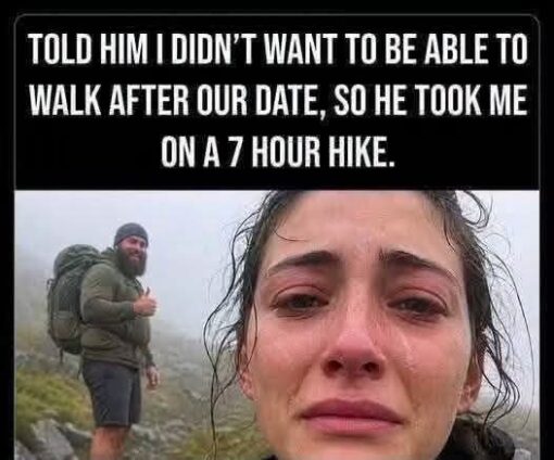 Dating Memes, Dirty Mind Memes, Dirty Talk Memes, Double Meaning Memes, Exhausted Memes, Funniest Memes, Hiking Memes, Innuendo Memes, Misunderstanding Memes, Not What I Meant Memes, Relationship Memes, Sex Memes, Tired Memes, The meme uses a classic black-caption panel with bold white uppercase text at the top. Beneath it, a drenched, exhausted-looking woman stares into the camera with watery eyes and a defeated expression, while a bearded man in hiking clothes and a large backpack stands behind her on a foggy mountain trail, giving a cheerful thumbs-up.