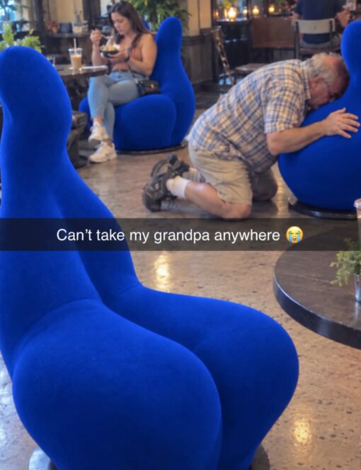 Awkward Memes, Dirty Mind Memes, Embarrassing Memes, Family Memes, Funniest Memes, Furniture Memes, Old People Memes, Weird Memes, WTF Memes, The meme shows a lounge or café filled with bright royal-blue sculptural chairs that have exaggerated, curvy shapes. In the background, an older man in a plaid shirt and shorts is kneeling on the floor with his arms around one of the chairs, pressing his face against it while other people sit nearby as if nothing unusual is happening. The caption across the image reads, “Can't take my grandpa anywhere 😭,” framing the scene as an embarrassing public moment caused by an unpredictable grandparent.