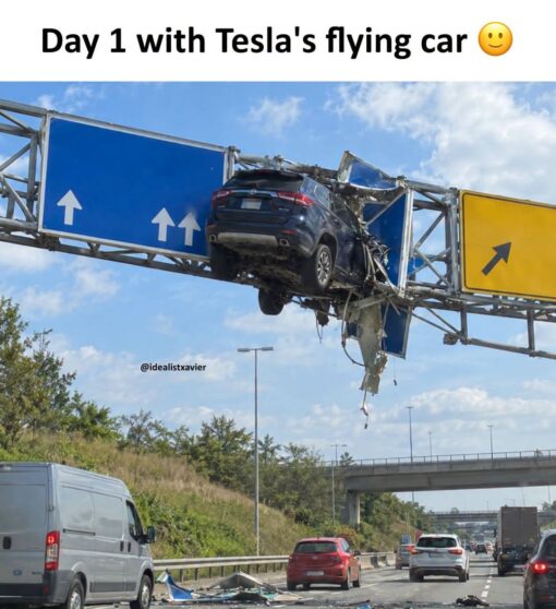Car Memes, Crash Memes, Current Event Memes, Driving Memes, Elon Musk Memes, Expectation vs Reality, Funniest Memes, Futuristic Memes, Pics Gone Wrong, Tech Memes, Tesla Roadster, Traffic Memes, WTF Memes, A dark blue SUV is lodged high up in an overhead highway sign structure, crumpling the metal panels and support beams like it somehow launched off the road and got stuck midair. Below it, regular traffic continues on the freeway, with debris scattered near the shoulder and a bright daytime sky making the absurd scene even clearer. At the top, bold text reads, “Day 1 with Tesla's flying car 😊,” followed by the creator tag “@idealistxavier,” turning what looks like a dramatic traffic accident into a fake product-review moment.