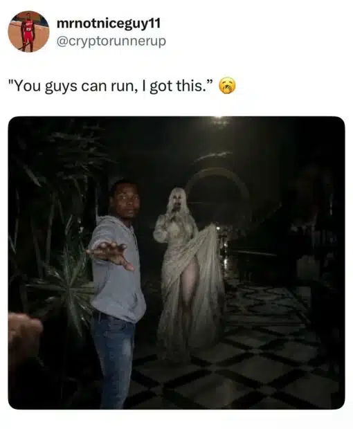 Confidence Memes, Creepy Memes, Funniest Memes, Ghost Memes, Horror Memes, Running Memes, Scary, Social Media Memes, Twitter Memes, A tweet-style meme shows the username mrnoticeguy11 with the handle @cryptorunnerup above the caption, “You guys can run, I got this.” Below it is a dark, horror-movie-like scene: a man in a hoodie stands in the foreground with one arm stretched out as if holding other people back, while a pale, ghostly woman or monster in a tattered dress looms behind him in a shadowy room.