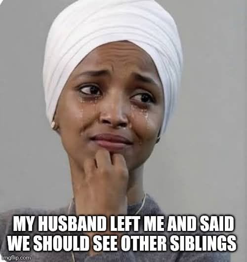 Breakup Memes, Dark Humor, Divorce Memes, Double Meaning Memes, Funniest Memes, Incest Memes, Marriage Memes, Offensive Memes, Play on Words Memes, Relationship Memes, Sibling Memes, Weird Memes, Wife Memes, The meme shows a close-up of a crying woman wearing a white headwrap, with tears running down her face and one hand tucked under her chin. Her expression looks wounded and overwhelmed, like she is processing devastating news while trying to hold herself together.
