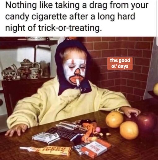 Costume Memes, Exhausted Memes, Food Memes, Funniest Memes, Good Ole Days Memes, Halloween Memes, Holiday Memes, Ironic Memes, Kid Memes, Smoking Memes, Snack Memes, Tired Memes, A small child in Halloween face paint sits slumped at a wooden table, still in costume, with a white candy cigarette hanging from their mouth like a tiny, overworked adult taking a smoke break. Pieces of Halloween candy are scattered in front of them, along with fruit on the table and a cozy, old-photo-looking home interior in the background.