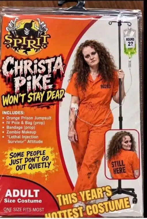 Convict Memes, Costume Memes, Current Event Memes, Dark Humor, Death Memes, Funniest Memes, Halloween Memes, Horror Memes, Law Memes, News Memes, Offensive Memes, Prison Memes, The image is styled like a fake Spirit Halloween costume package, with bright orange retail-card graphics, a grim reaper-style Spirit logo, and oversized horror lettering announcing “CHRiSTA PiKE WON'T STAY DEAD.” The “costume” model wears an orange prison jumpsuit, messy zombie-like makeup, bandages, and holds an IV pole with a greenish fluid bag labeled “ROUND 2?” The packaging leans into a trashy seasonal-store look: bullet-pointed costume accessories, “ADULT Size Costume,” “ONE SIZE FITS MOST,” and a big yellow slogan calling it “THIS YEAR'S HOTTEST COSTUME.” A small inset image shows the back of the jumpsuit reading “STILL HERE,” turning the whole image into a faux Halloween product ad built around prison, execution, and undead imagery.