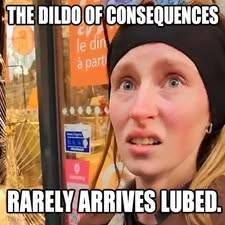 Adage Memes, Dildo Memes, Dirty Mind Memes, Double Meaning Memes, FAAFO Memes, Fuck Around And Find Out Memes, Funniest Memes, Innuendo Memes, NSFW, Poor Decisions Memes, Regret Memes, Savage Memes, Sex Toy Memes, Voting consequences girl, The meme shows a close-up of a wide-eyed woman wearing a black beanie, looking startled, uncomfortable, or like she has just realized something has gone very wrong. The background appears to be an outdoor storefront or street scene, slightly blurred so the expression is the focus.