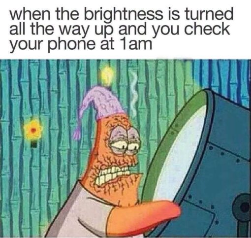 Cartoon Memes, Dark Mode Memes, Funniest Memes, Funny Text Memes, Phone Memes, Sleep Memes, SpongeBob Memes, Tech Memes, Time Memes, Tired Memes, A SpongeBob-style cartoon image shows Patrick Star hunched close to a glowing screen in a dark, greenish room. His face looks exhausted and painfully overexposed, with bulging tired eyes, clenched teeth, and a harsh orange-red glow blasting across him from the screen.