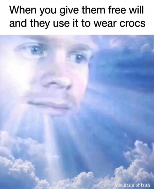 Bible Memes, Christian Memes, Fashion Memes, Funniest Memes, Jesus Memes, Judgement Memes, Religious Memes, Shoe Memes, Spiritual Memes, A glowing, blue-tinted face appears in the clouds like a divine figure looking down from heaven. The expression is calm but faintly disappointed, as if silently judging humanity from above. At the top, bold black text reads, “When you give them free will and they use it to wear crocs,” while a small “Mountain of faith” label sits in the bottom-right corner, reinforcing the religious/faith-themed framing.