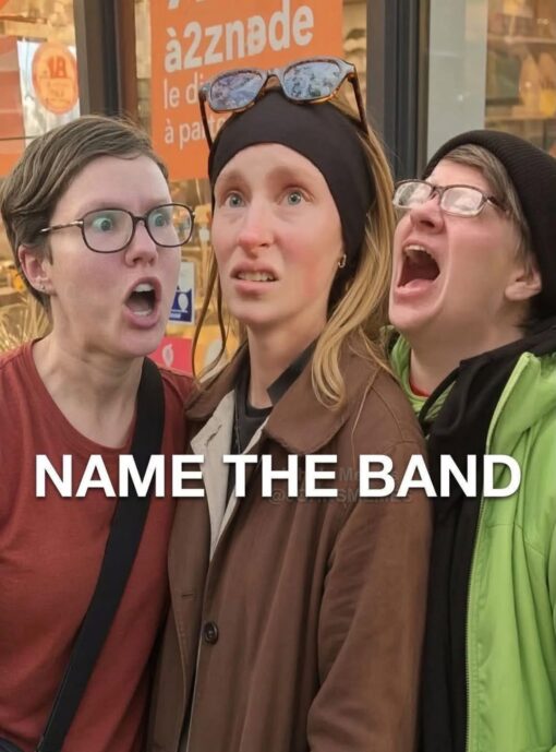 Confused Memes, Funniest Memes, Funny Text Memes, Music Memes, Pop Culture Memes, Rock Memes, Weird Memes, The meme shows three people standing close together in front of a storefront, posed like an awkward candid band photo. The person on the left stares wide-eyed with their mouth open, the person in the middle looks startled and uneasy, and the person on the right is leaning in with their mouth wide open as if singing, screaming, or laughing dramatically. Behind them is an orange sign with partial text reading “àzznde / le di / à pa,” while large bold white lettering across the lower half says “NAME THE BAND.” The combination makes the whole image feel like an accidental album-cover shoot for some extremely niche indie group.